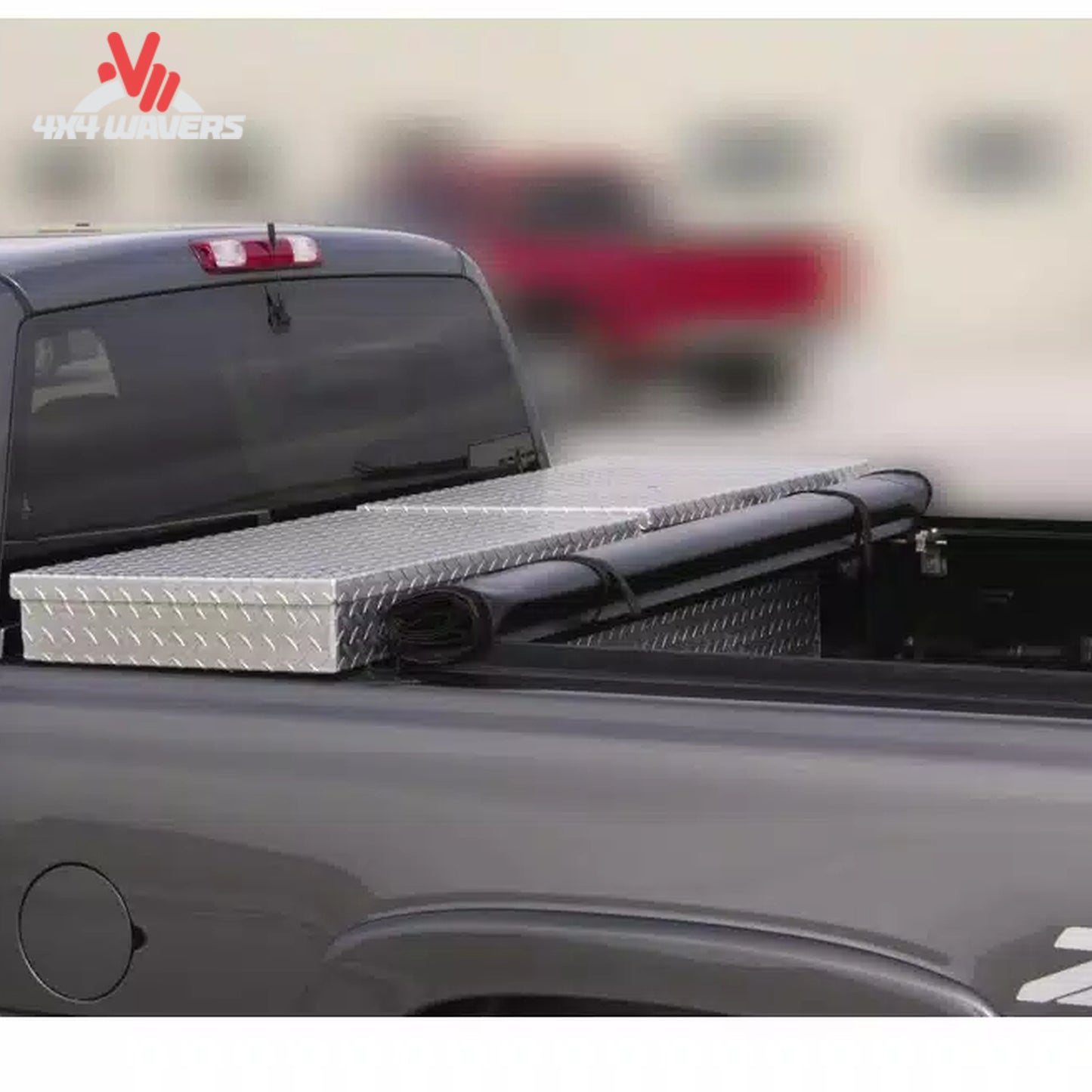 Close-up detail showing the aluminum header bar and foam gasket sealing the tonneau cover against the back of a metal crossover toolbox SKU BGPC_61379.