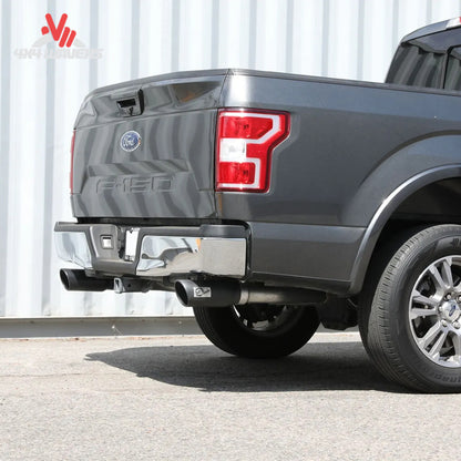 An underbody view showing 3 inch mandrel bent stainless steel exhaust pipes mounted to factory isolators on an F-150 SKU BKJC_49-33130-B.