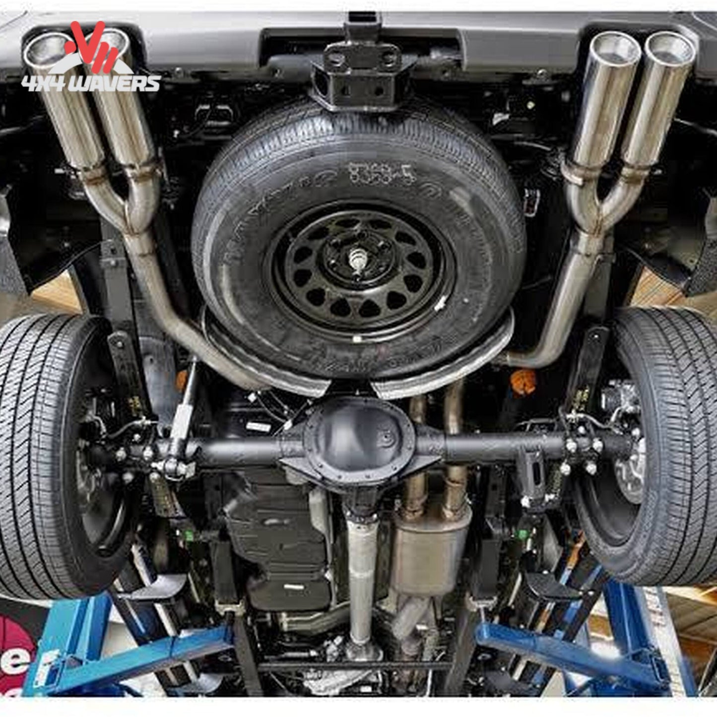 Underbody view of dual exit stainless exhaust connecting to factory tips SKU 49-34101