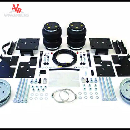 A complete LoadLifter 5000 air spring suspension kit including 2-ply rubber bellows, mounting brackets, and air lines for an F-150 PowerBoost SKU BBCG_57389.