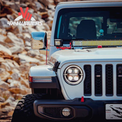 Faros delanteros tipo proyector LED AlphaRex NOVA en negro instalados en un Jeep Wrangler JL 2018-2026, mostrando la vista frontal.