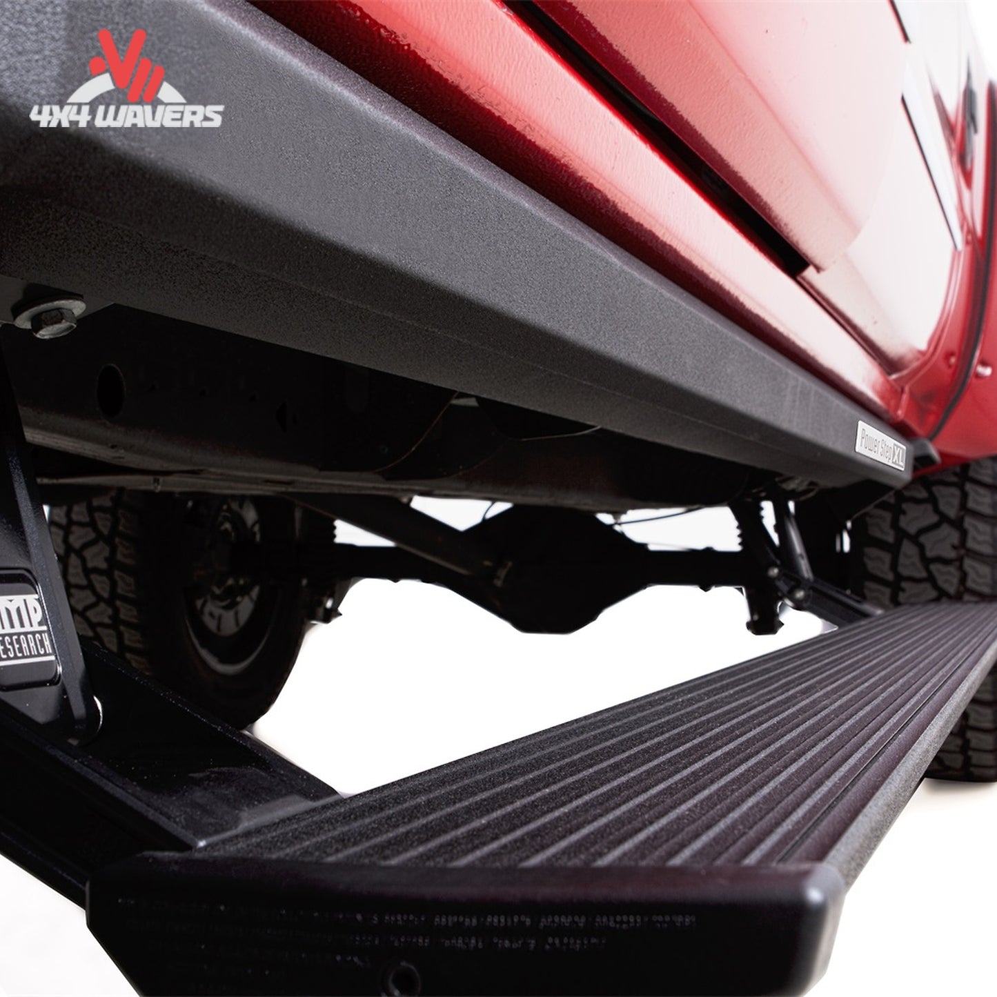 Deployed AMP PowerStep XL running board on lifted Chevy Silverado 2500HD SKU 77154-01A