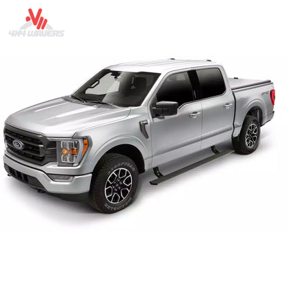 Side profile view of a Ford F-150 truck with AMP Research PowerSteps extended in the deployed position with LED lights illuminated SKU BGQD_76152-01A.