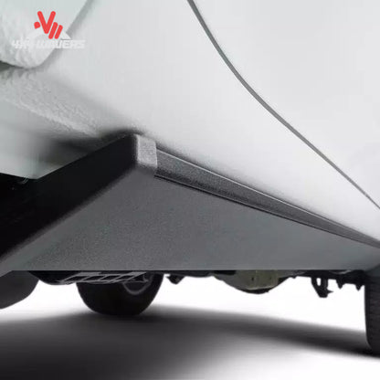Close-up detail showing the electric step retracted flush against the truck rocker panel for maximum ground clearance SKU BGQD_76152-01A.