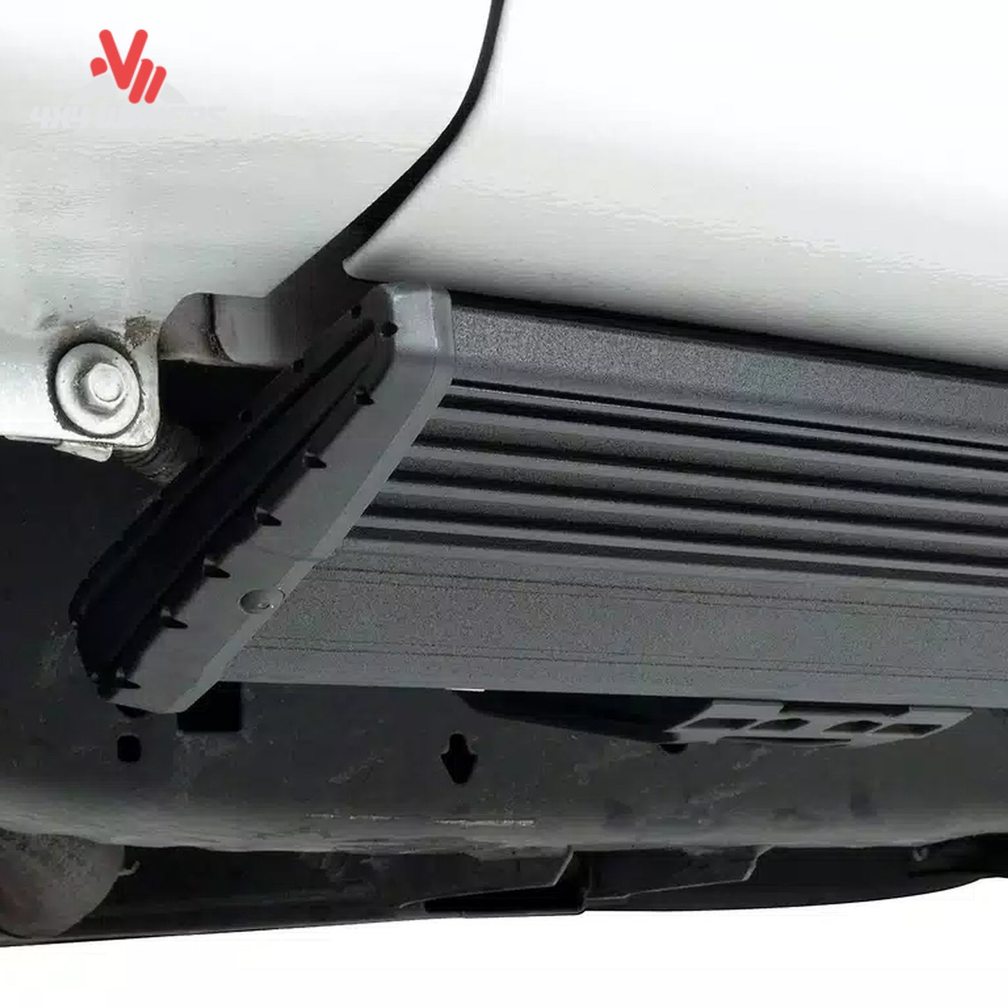 Close-up detail showing the dual-motor electric step retracted flush against the rocker panel for ground clearance SKU BGQD_78152-01A.