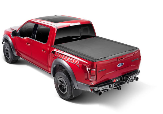 BAK Revolver X4s hard roll-up tonneau cover in matte black on Jeep Gladiator with 5ft bed, featuring aluminum slats and secure closure.