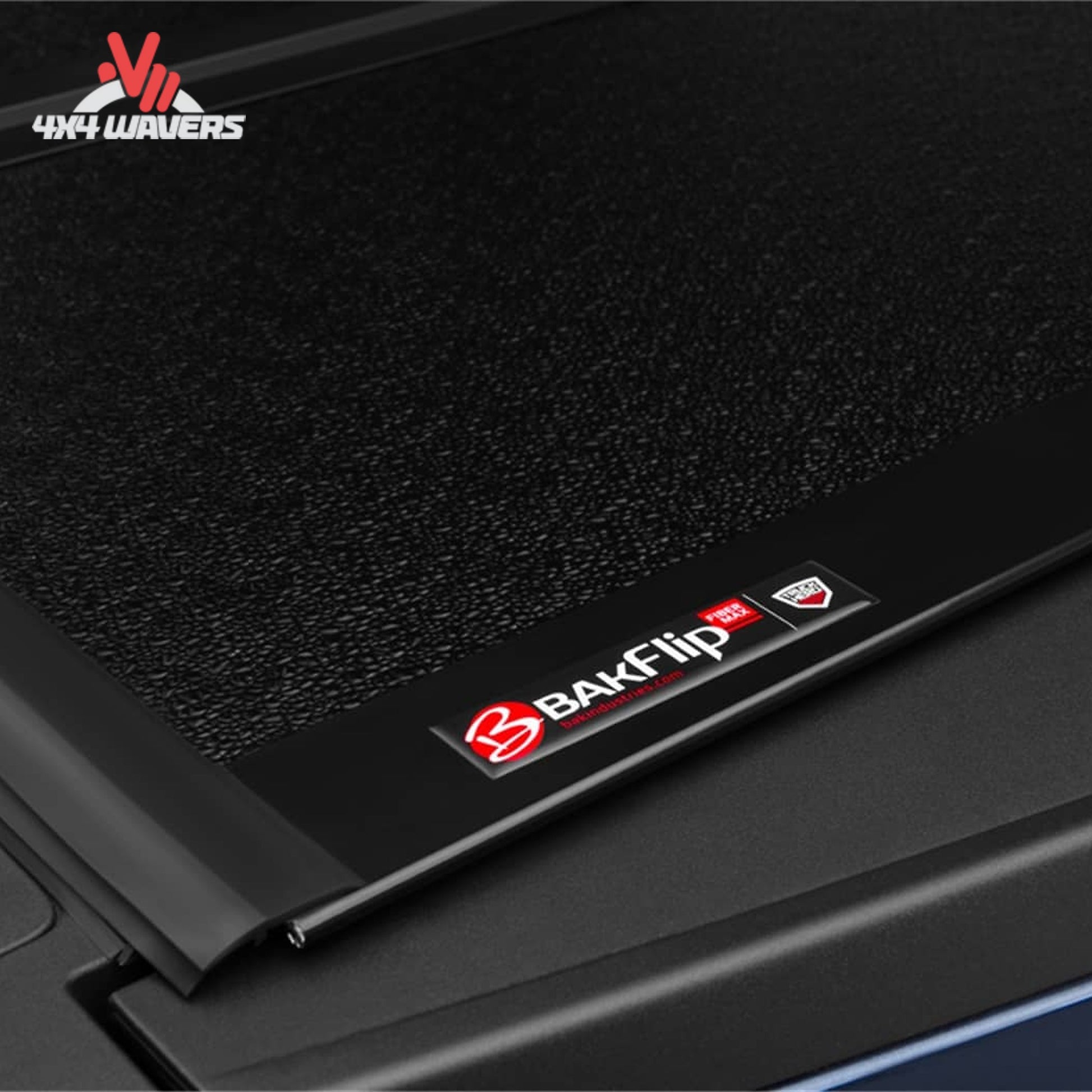 BAKFLIP MX4 hard folding tonneau cover on a 2015-2020 Ford F-150 with 6.5-foot bed, showing dual-action tailgate seal.
