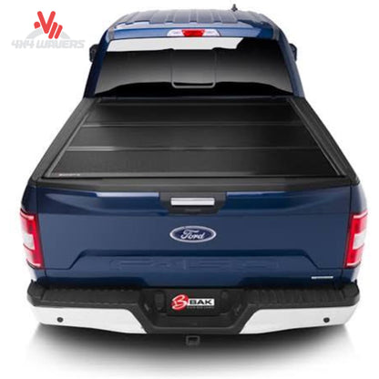 BAKFLIP MX4 hard folding tonneau cover on a 2015-2020 Ford F-150 with 6.5-foot bed, showing the dual-action tailgate seal.