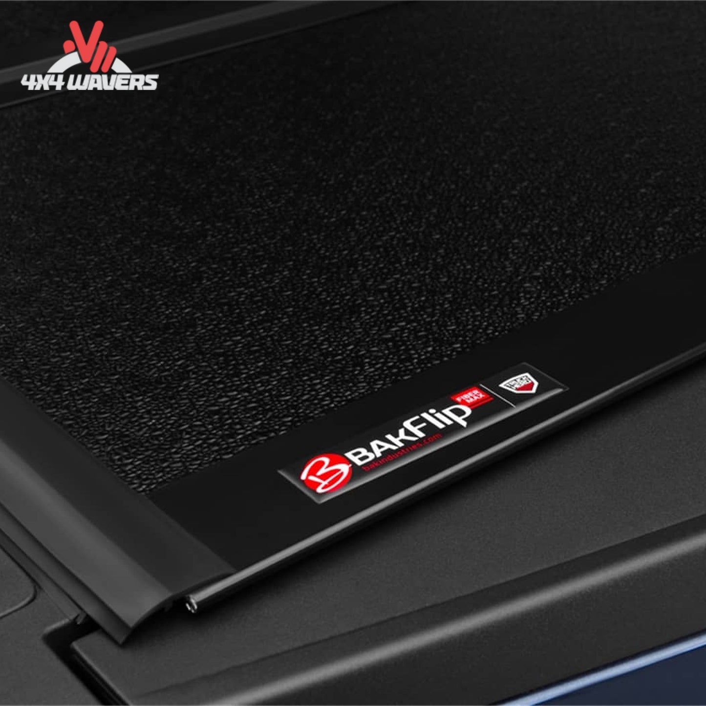 BAKFLIP MX4 hard folding tonneau cover on a 2015-2020 Ford F-150 Raptor 5.5' bed, showing dual-action tailgate seal.