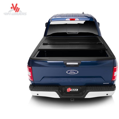 BAKFLIP MX4 hard folding tonneau cover on a 2015-2020 Ford F-150 with 5.5-foot bed, showing full bed access and prop rods.