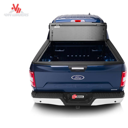 BAKFLIP MX4 hard folding tonneau cover on a 2015-2020 Ford F-150 or Raptor 5.5' bed, showing full bed access and support rods.