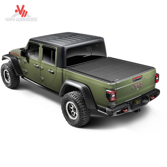 BAKFlip MX4 TS hard folding tonneau cover installed on a 2020-2026 Jeep Gladiator JT, showcasing durable black design and secure locking mechanism.