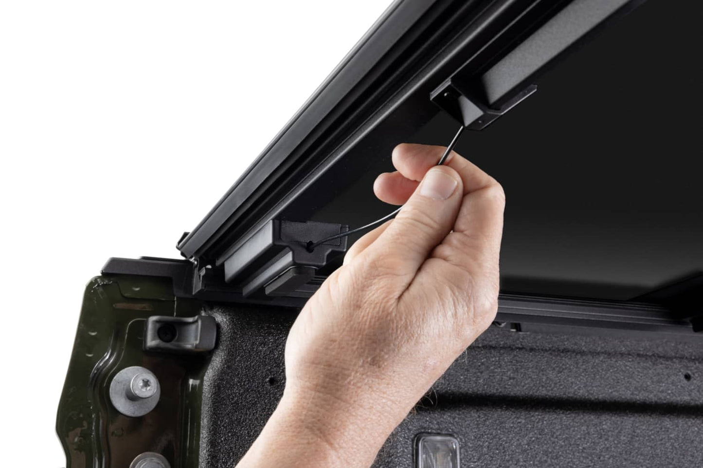 Close-up of BAKFlip MX4 TS hard folding tonneau cover with T-slot rails on a Jeep Gladiator 5ft bed, showing durable aluminum construction.