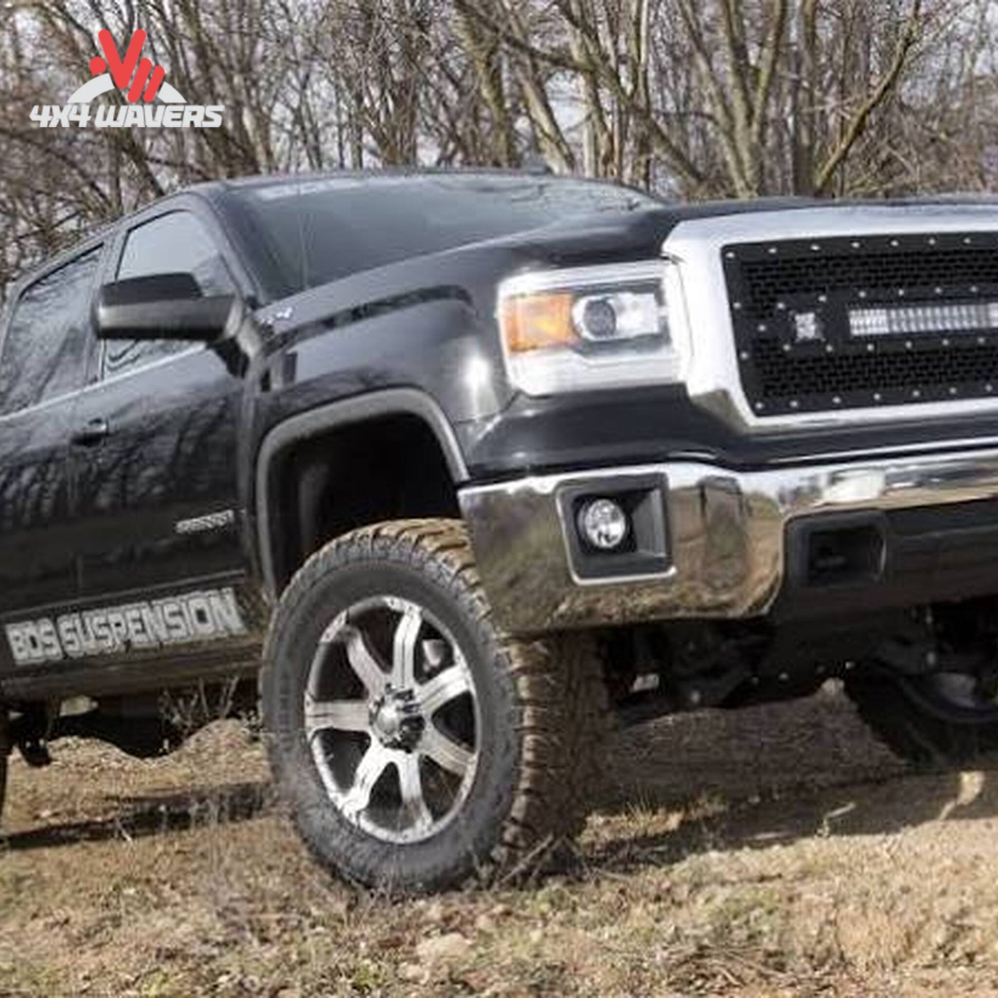 Side profile of lifted GMC Sierra 1500 4WD on 35 inch off road tires SKU BDS710F