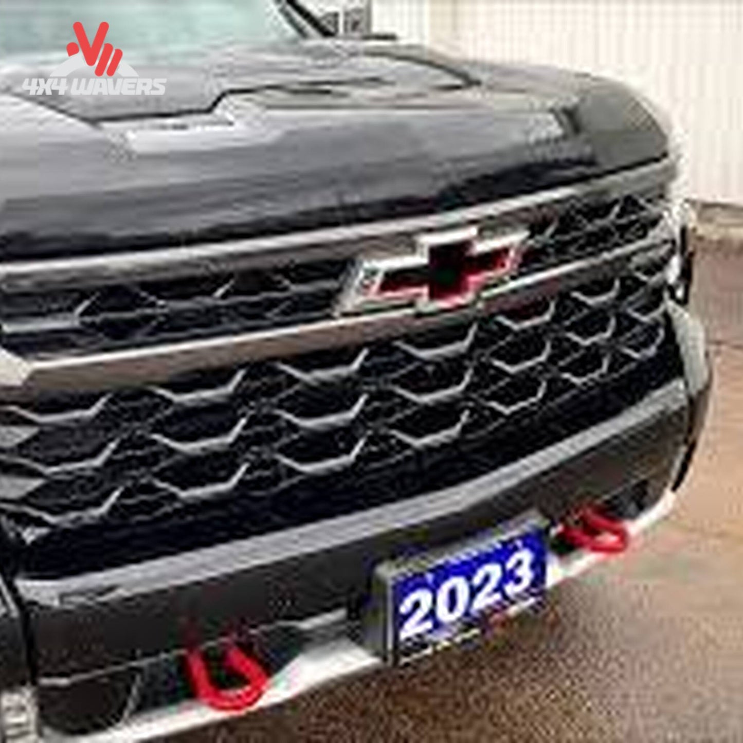 Removable attachment tabs protruding cleanly through front bumper mesh on Silverado ZR2 SKU BX1757