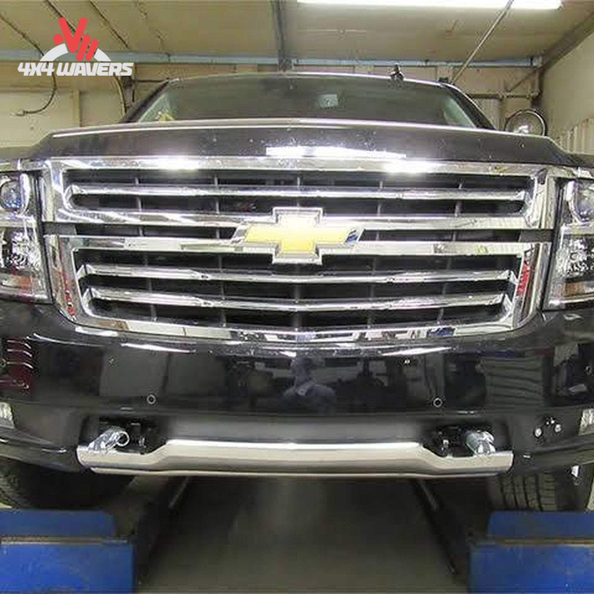 Removable attachment tabs protruding cleanly through front bumper mesh on Tahoe Z71 SKU BX1731