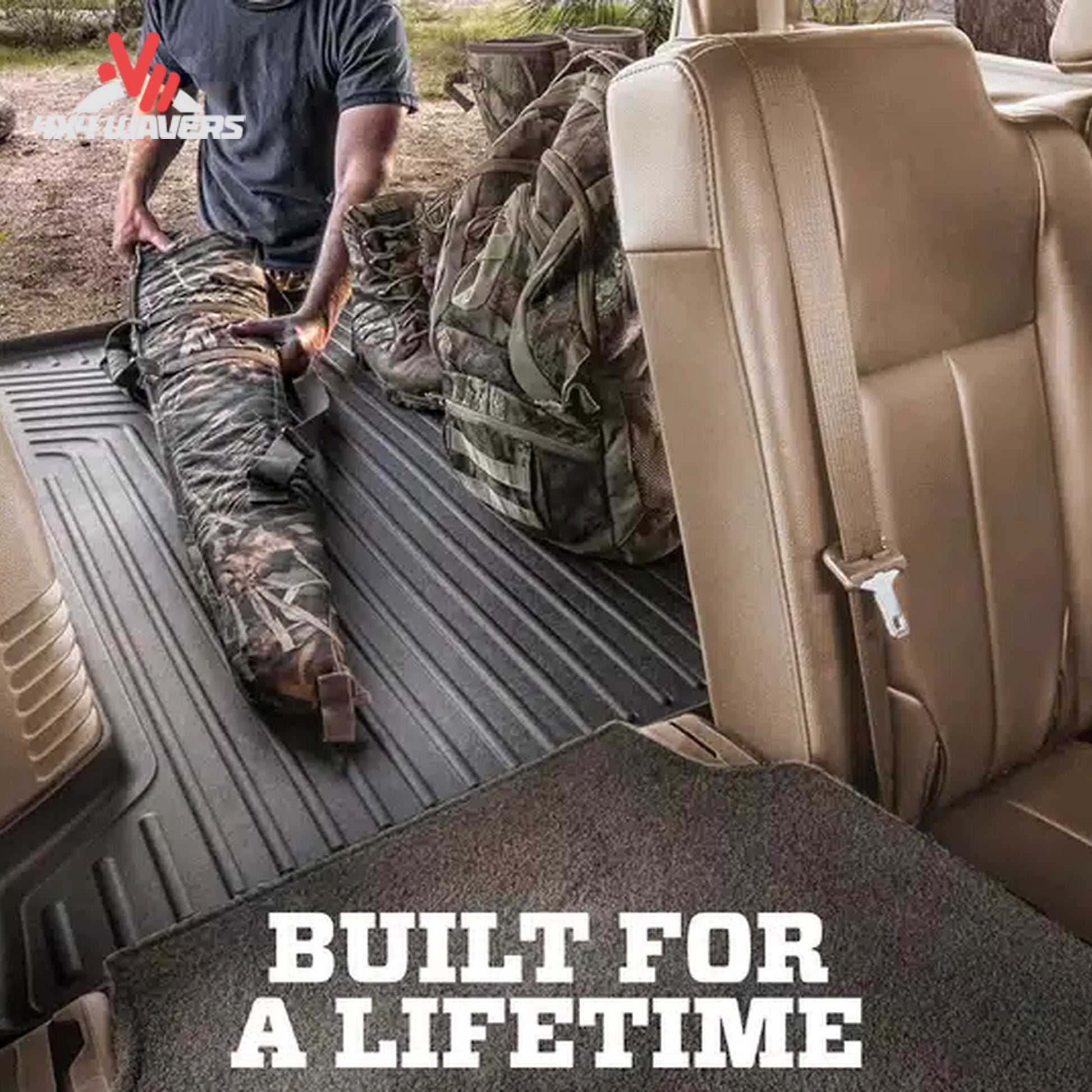 Husky WeatherBeater cargo liner safeguarding camping equipment and off-road recovery tools inside a Bronco