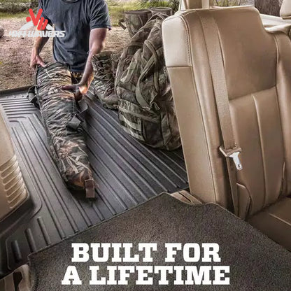Husky WeatherBeater cargo liner safeguarding camping equipment and off-road recovery tools inside a Bronco