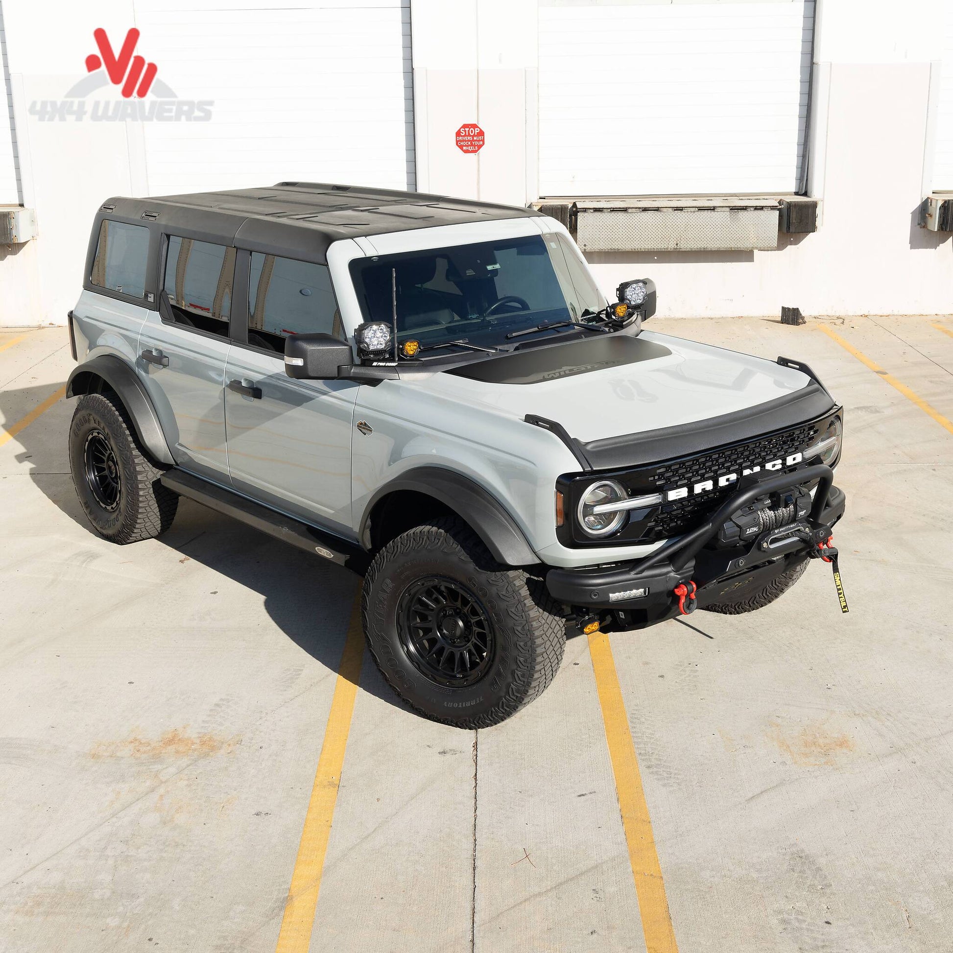 Modified Ford Bronco featuring upgraded front-end armor and off-road protection