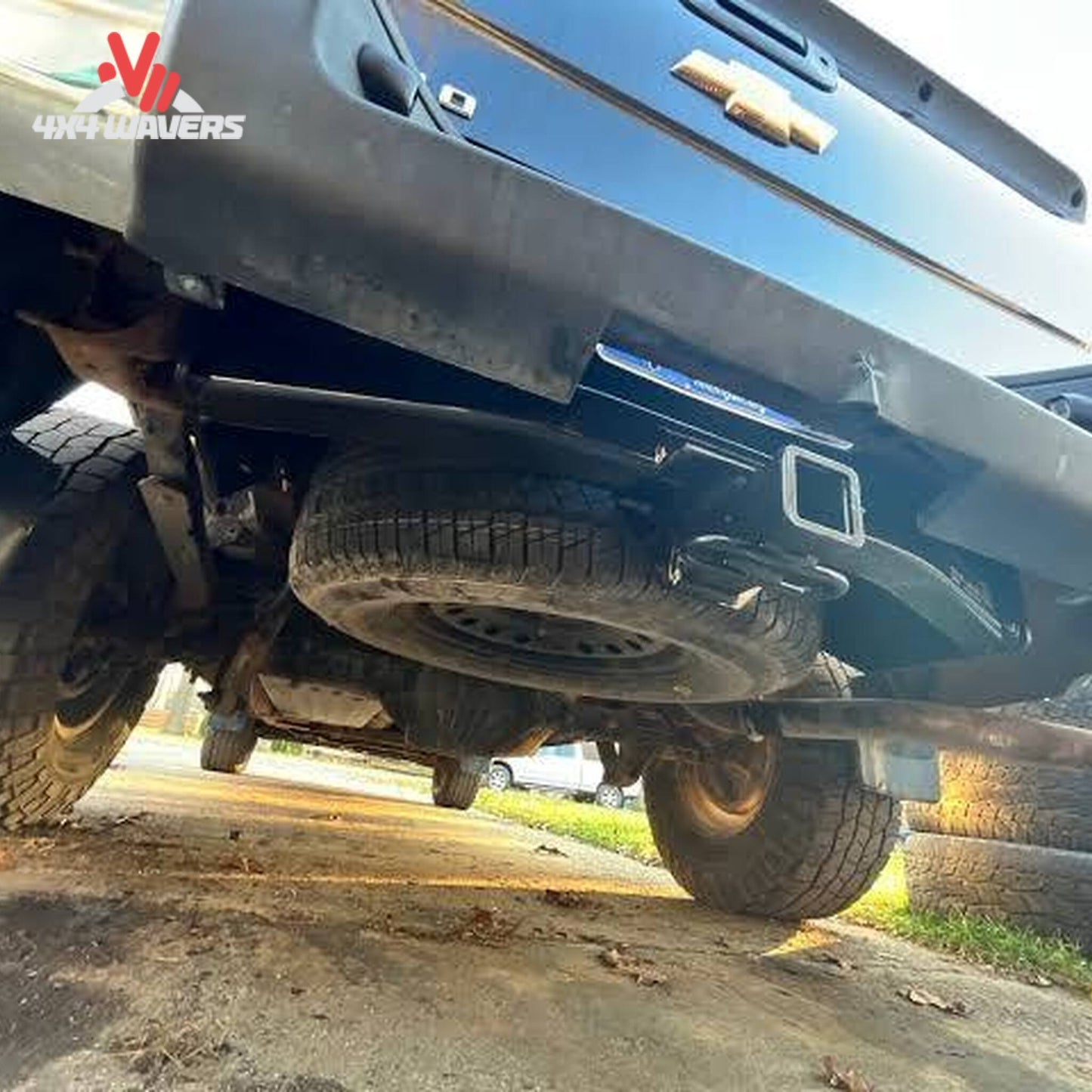 Rear view of Chevrolet Silverado truck showing concealed CURT 2-inch tow receiver hitch SKU 14301