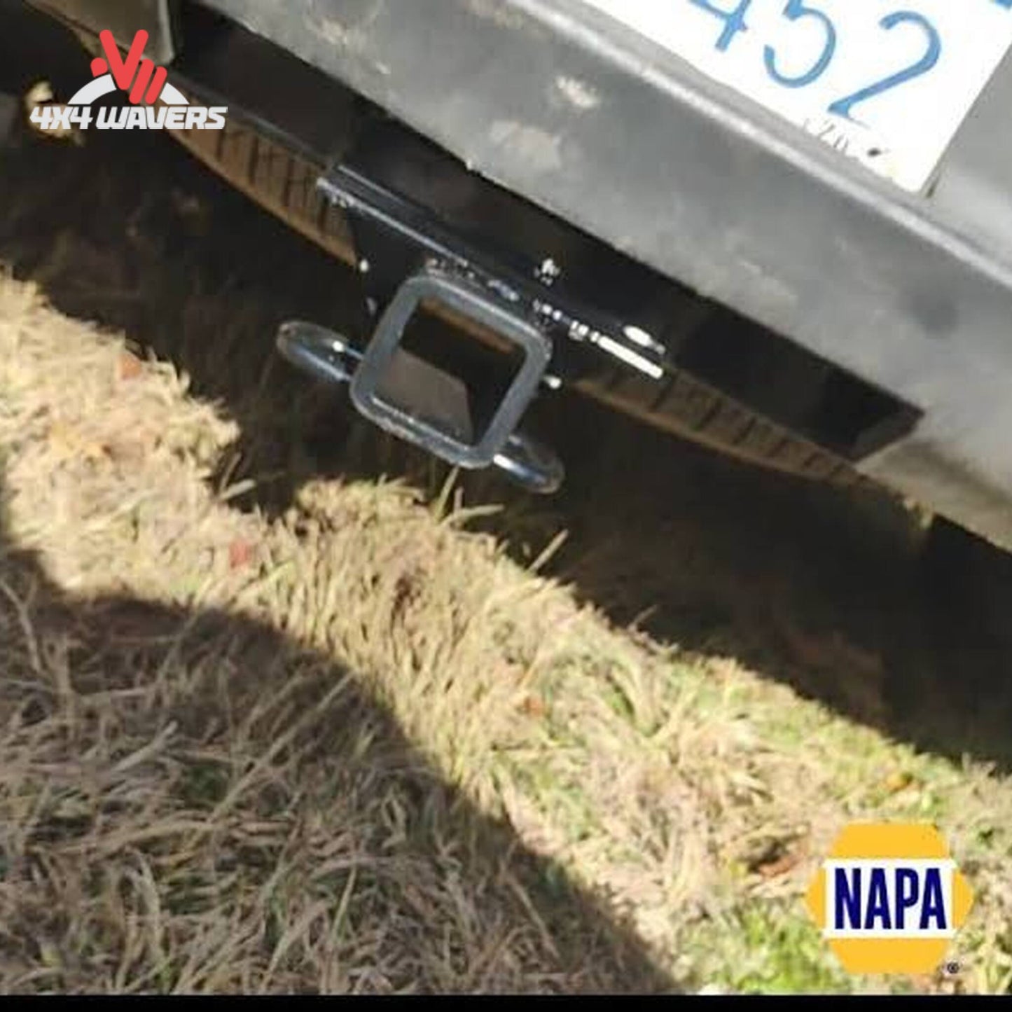 Rear view of GMC Sierra truck showing concealed CURT 2-inch tow receiver hitch SKU 14301