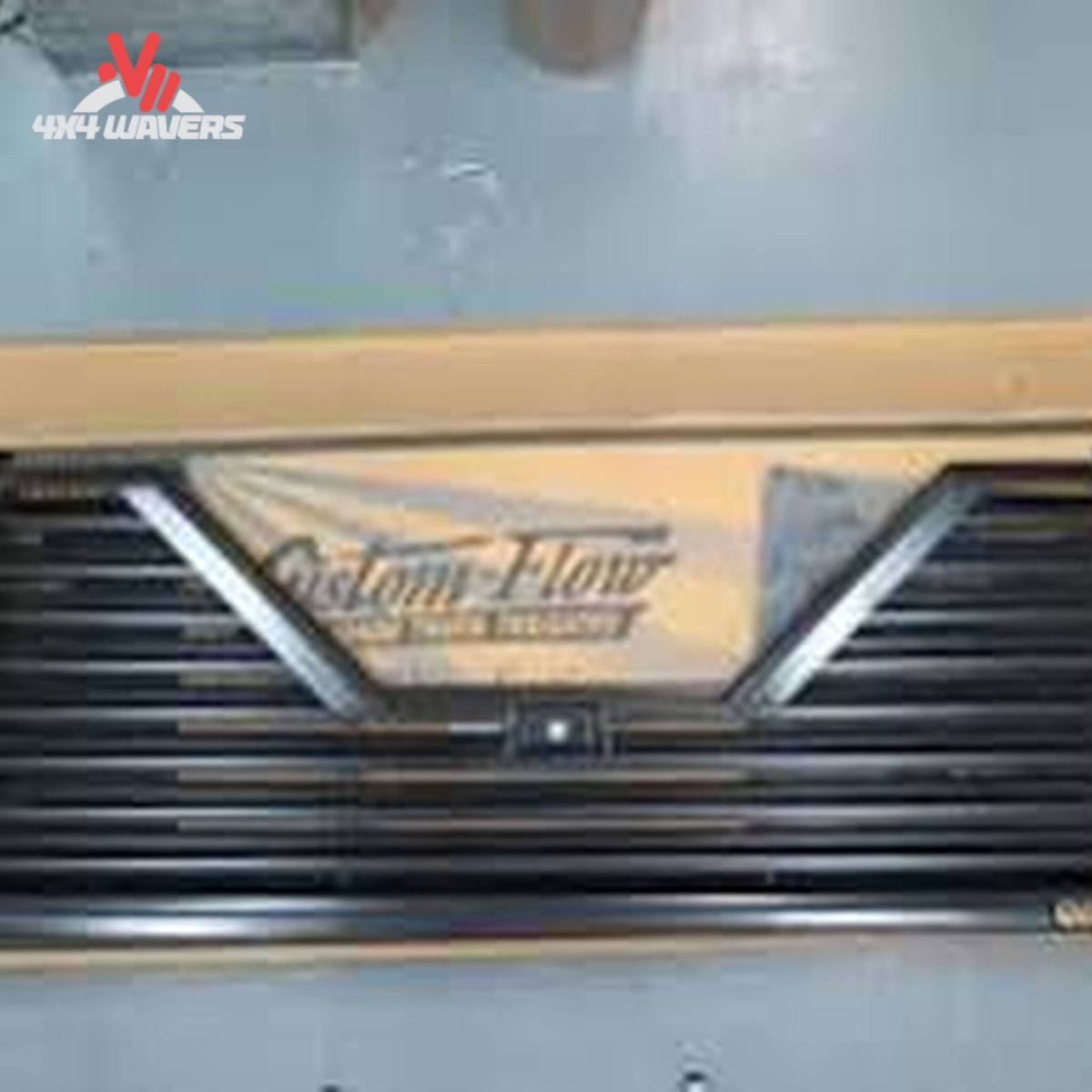 Custom Flow Elite louvered tailgate installed on 2009-2014 Ford F150 pickup truck, showcasing sleek design and durable construction