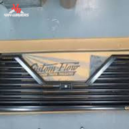 Custom Flow Elite louvered tailgate installed on 2009-2014 Ford F150 pickup truck, showcasing sleek design and durable construction