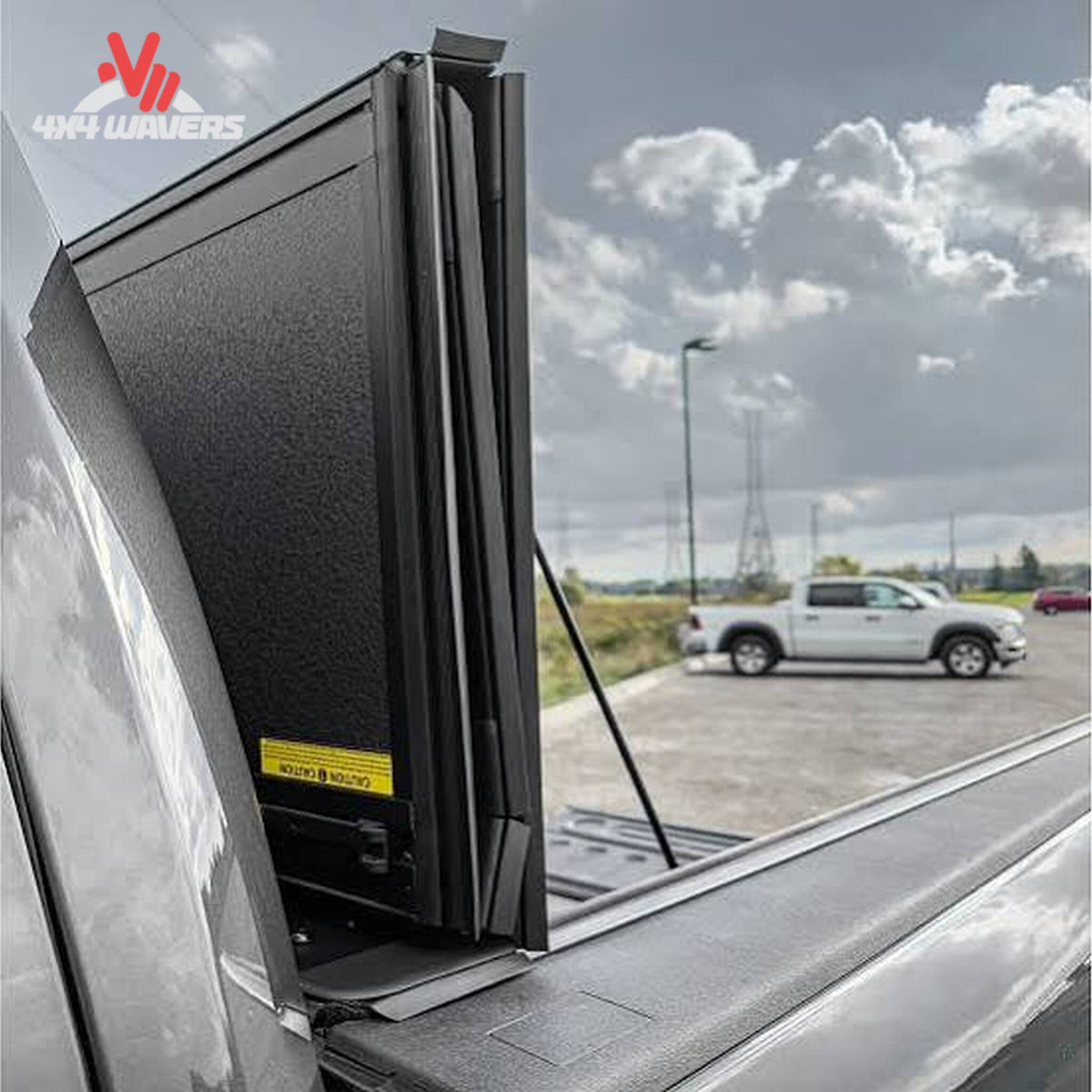 Close-up of Dura-Flip hard folding tonneau cover quick-release clamps on a 04-14 Ford F150 6.5ft bed for secure, easy bed access.
