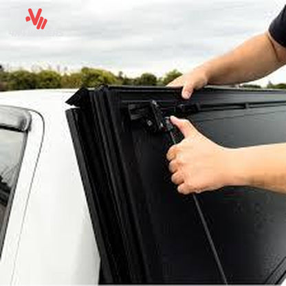 Close-up of Dura-Flip Hard Folding Tonneau Cover quick-release clamps on a 04-14 Ford F150 6.5ft bed for secure truck bed protection.