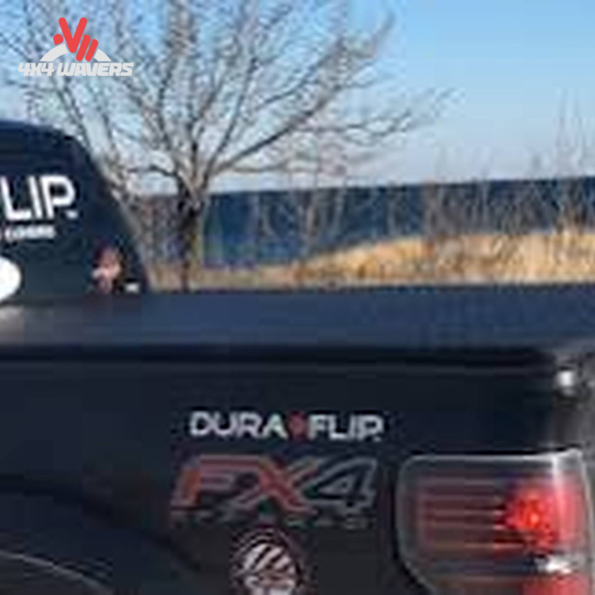 Dura-Flip hard folding tonneau cover installed on a 15-26 Ford F150 with 6.5 ft bed, protecting the truck bed from weather and debris.