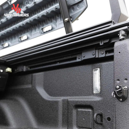 Close-up of EGR RollTrac aluminum slat tonneau cover on a 2020–2026 Jeep Gladiator JT 5-foot bed, showing sleek design and locking mechanism.