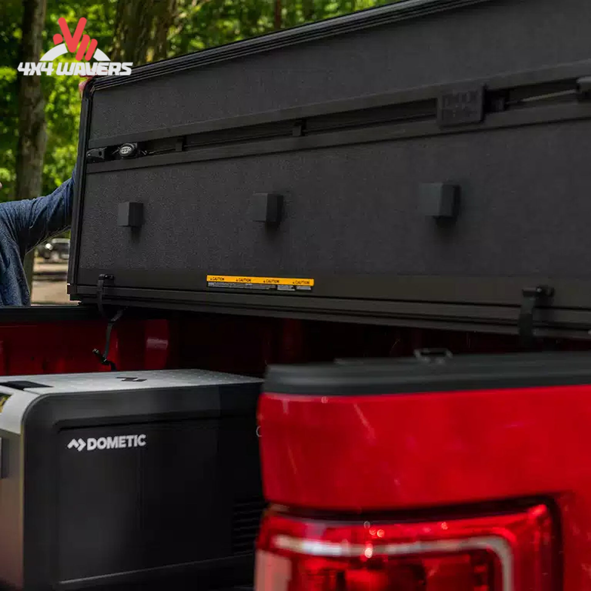 Extang Solid Fold ALX tonneau cover open on a 2015-2020 Ford F-150 with 5.5-foot bed, showing its foldable design and bed access.