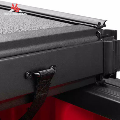 Close-up of Extang Solid Fold ALX Tonneau Cover with jaw grip clamp on a 2015-2020 Ford F-150 5.5ft bed, showing secure fastening details.