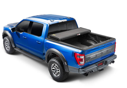 Open view of Extang Solid Fold ALX hard folding tonneau cover on a 2020-2026 Jeep Gladiator JT 5-foot bed without trail rail system