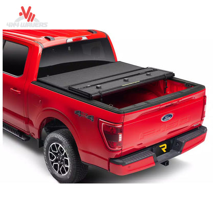 Extang Solid Fold ALX tonneau cover on a 2015-2020 Ford F-150 with 5.5ft bed, shown closed over truck bed for protection.