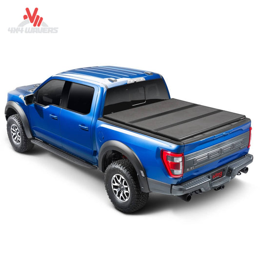 Extang Solid Fold ALX tonneau cover on a 2015-2020 Ford F-150 with 6.5-foot bed, shown folded on the truck bed.