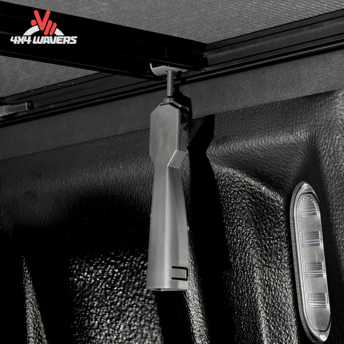 Close-up of Extang Trifecta 2.0 tonneau cover hinge and EZ Lock clamp on a 2009-2014 Ford F-150 6.5ft bed.