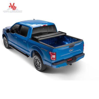 Extang Trifecta ALX tonneau cover folded open on a 2015-2020 Ford F-150 with 5.5ft bed, showing bed access and cover design.
