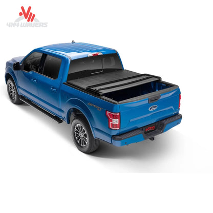 Extang Trifecta ALX tonneau cover folded open on a 2015-2020 Ford F-150 with 6.5-foot bed, showing bed access and cover design.
