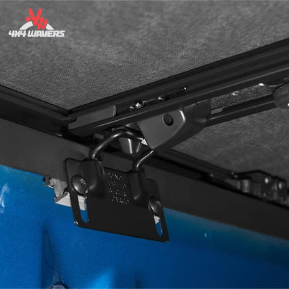 Close-up of Extang Trifecta ALX tonneau cover with jaw grip clamp on a 2015-2020 Ford F-150 6.5ft bed, showing secure installation details.