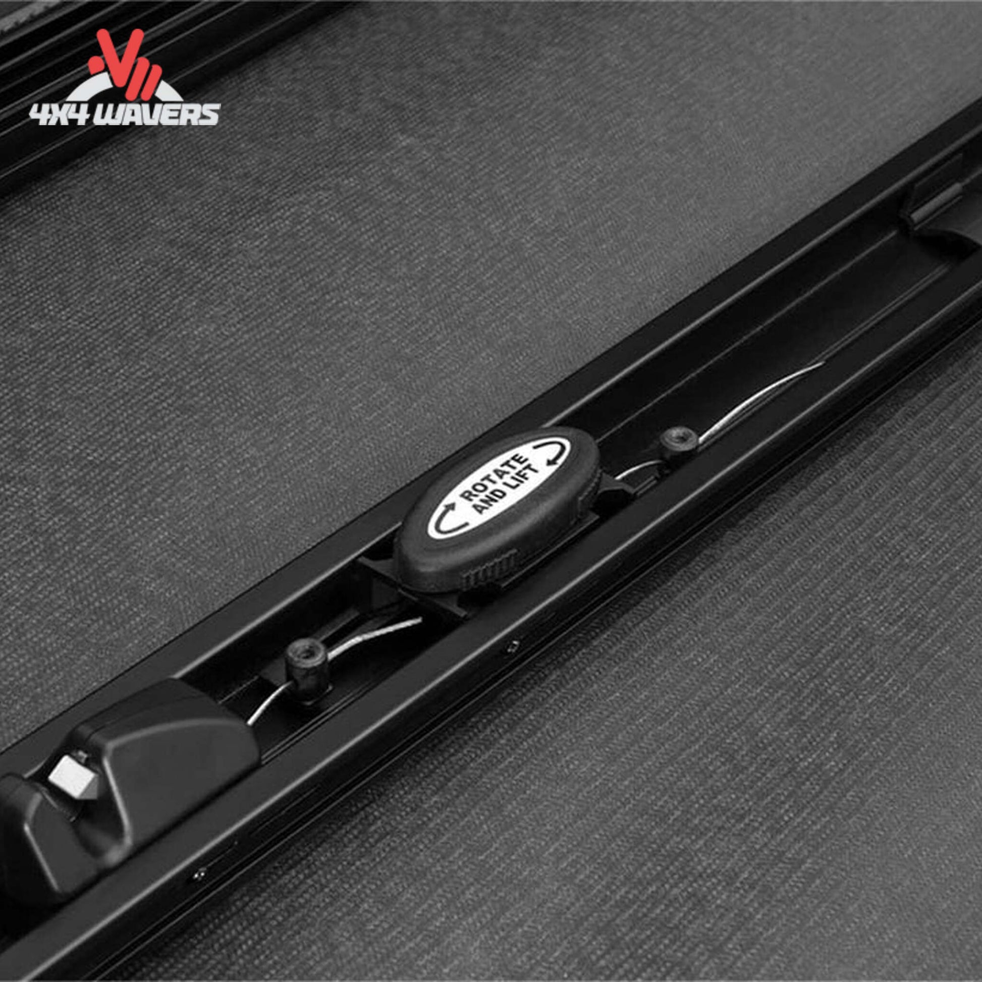 Close-up of Extang Trifecta ALX Tonneau Cover rotary release latch on a 2015-2020 Ford F-150 with a 5.5ft bed