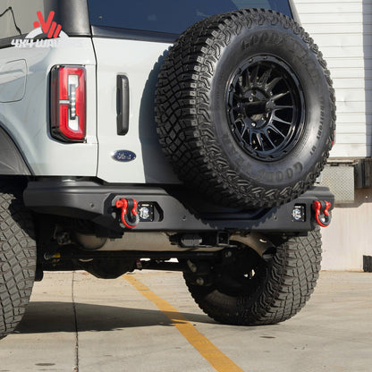 Rear view of a Ford Bronco showing the Smittybilt XRC bumper with factory sensor integration