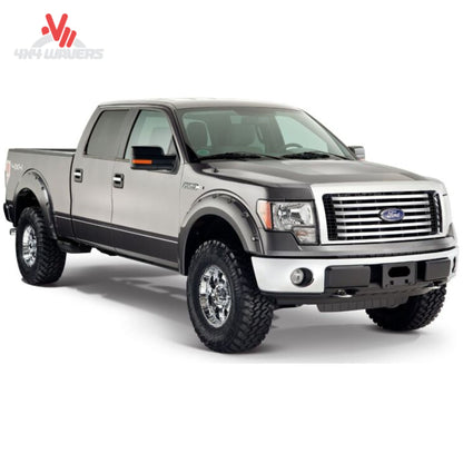 Husky Pocket Style Fender Flares installed on a 2009-2014 Ford F-150 pickup truck, showing durable black accents and fitment details.