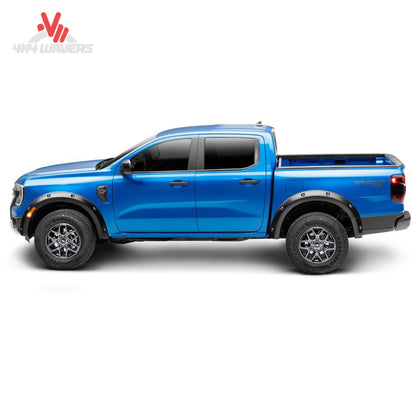 Husky Pocket Style Fender Flares installed on a 2021-2026 Ford F-150 pickup truck, durable accessories enhancing truck's look and protection.