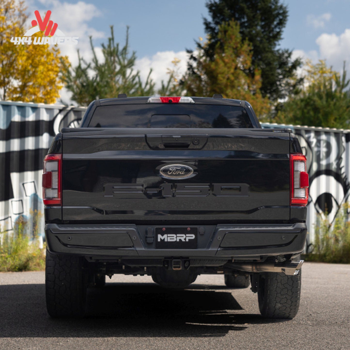 Ford F-150 with MBRP Armor Pro 3-Inch Cat-Back Exhaust featuring polished dual side tips installed on a truck.