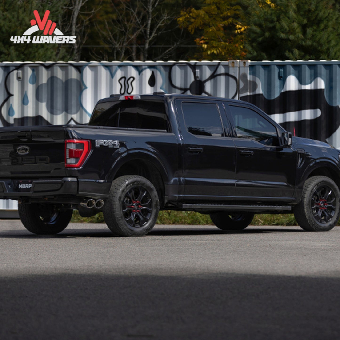 Ford F-150 with MBRP Armor Pro 3-Inch Cat-Back Exhaust system featuring polished dual side tips, installed on the truck.
