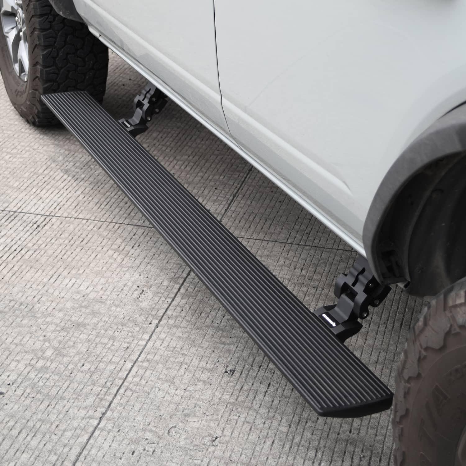 Go Rhino E1 electric running boards on a 2018-2025 Jeep Wrangler JL, side view showing automatic power step installation.