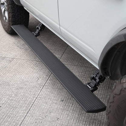 Go Rhino E1 electric running boards on a 2018-2025 Jeep Wrangler JL, side view showing automatic power step installation.