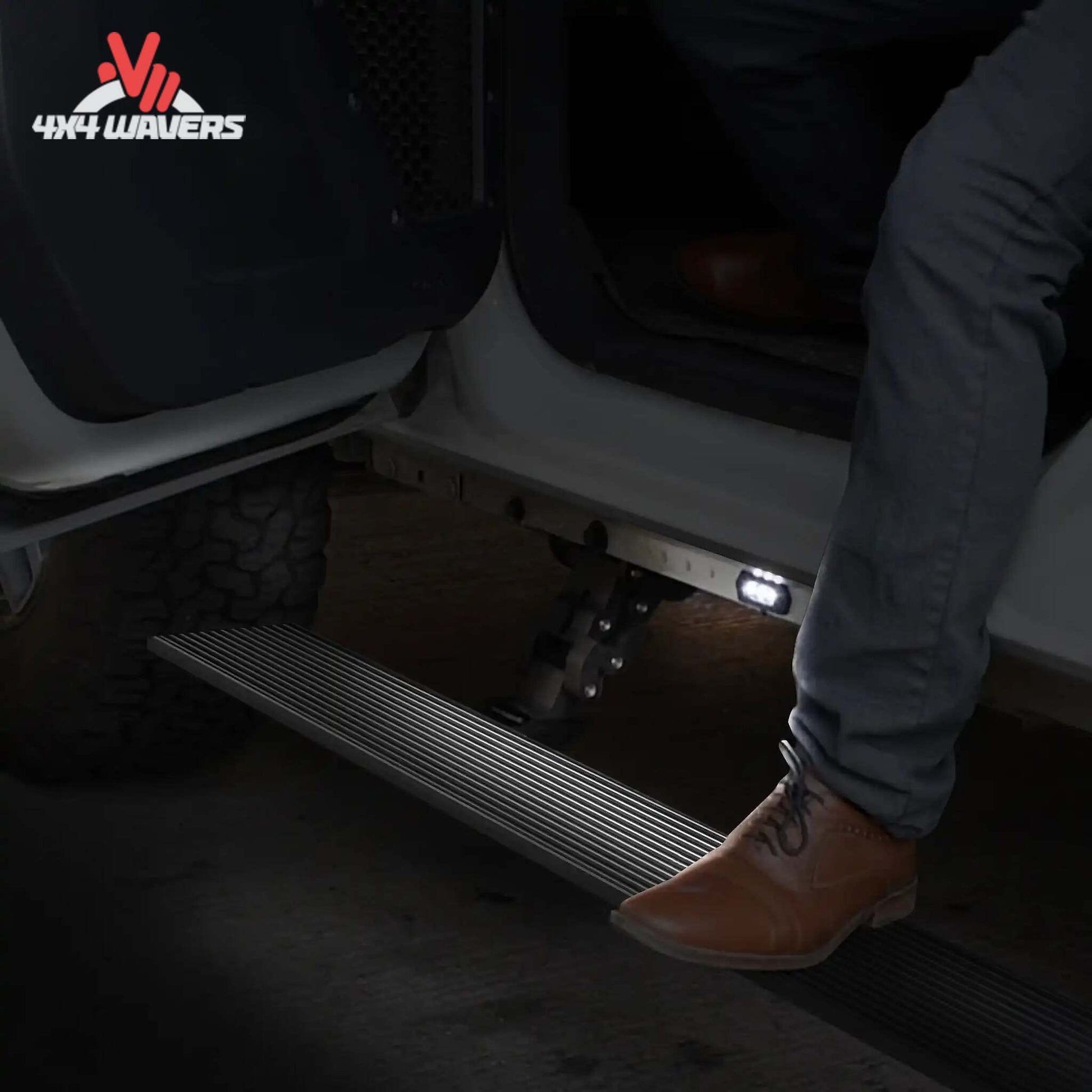 Go Rhino E1 Electric Power Running Boards with LED lighting and anti-slip texture on a Ford F-150 or Super Duty Crew Cab pickup truck.