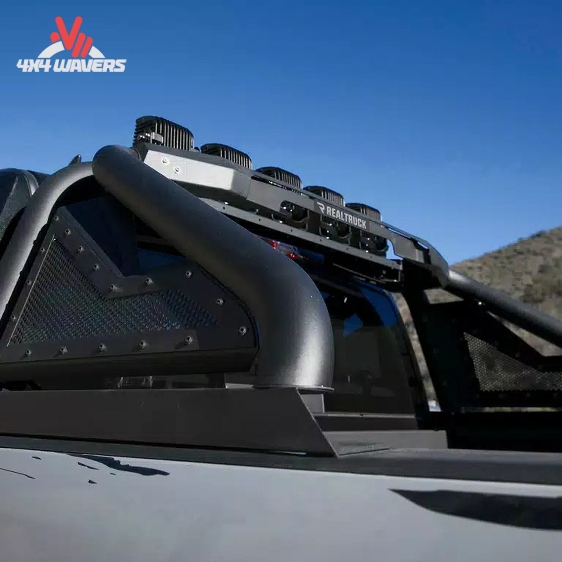 Go Rhino Sport Bar 2.0 bed-mounted roll bar with fixed light mount on a 2015-2026 Ford F-150 pickup truck.
